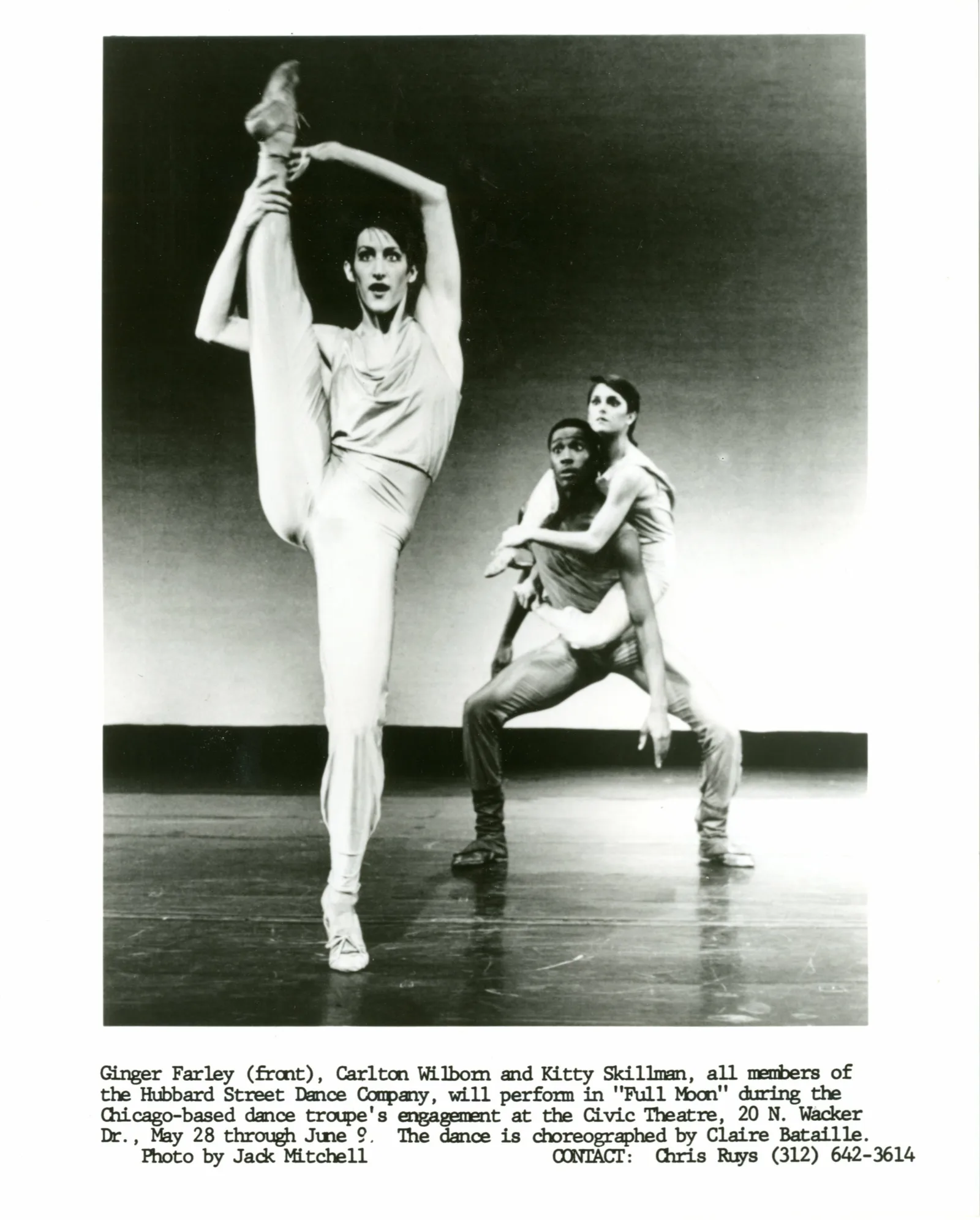 Hubbard Street Dance Chicago One dancer in foreground holds leg over head, second dancer in background holds third dancer on his back, both gazing at the dancer in the foreground.