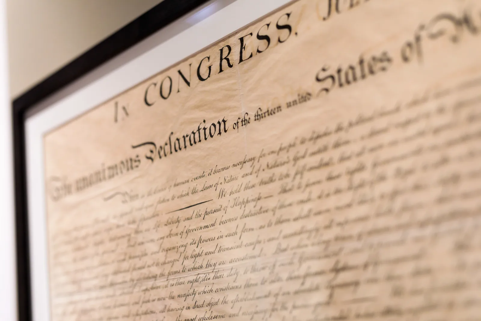 Declaration of Independence The text of the Declaration of Independence appears on display under glass. Though the text appears to be handwritten, it was actually engraved.